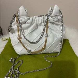 Tory Burch mini fleming distressed leather hobo bag.